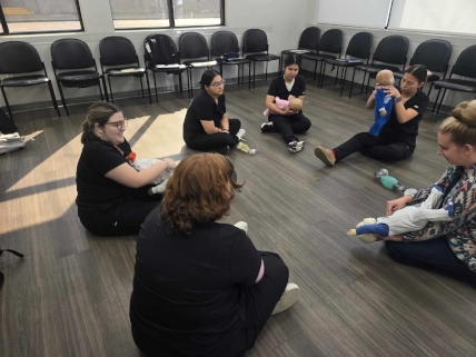 Odessa DAS students practicing CPR techniques on manikins during Week 4 hands-on training